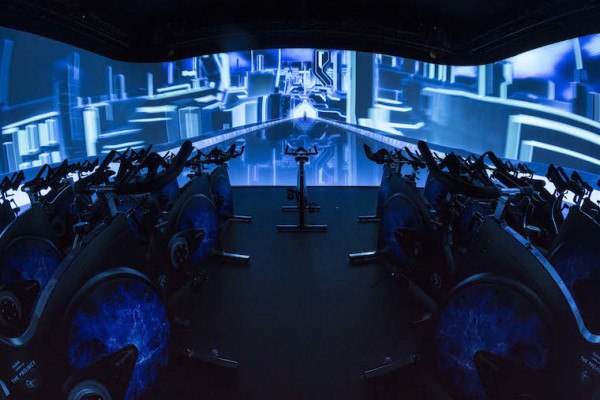 Will Cycling in Front of a Big Screen Catch on As a Fitness Trend?