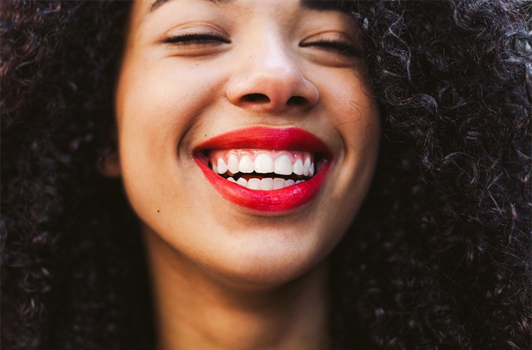 7 festive red lipsticks that are all-natural—and will actually stay put