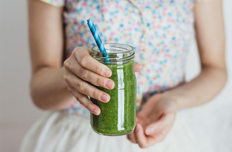 woman with green smoothie