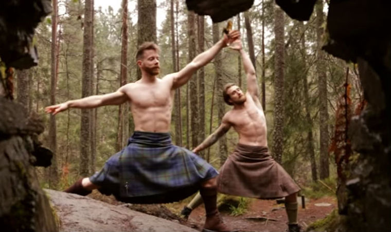 men in kilts doing yoga