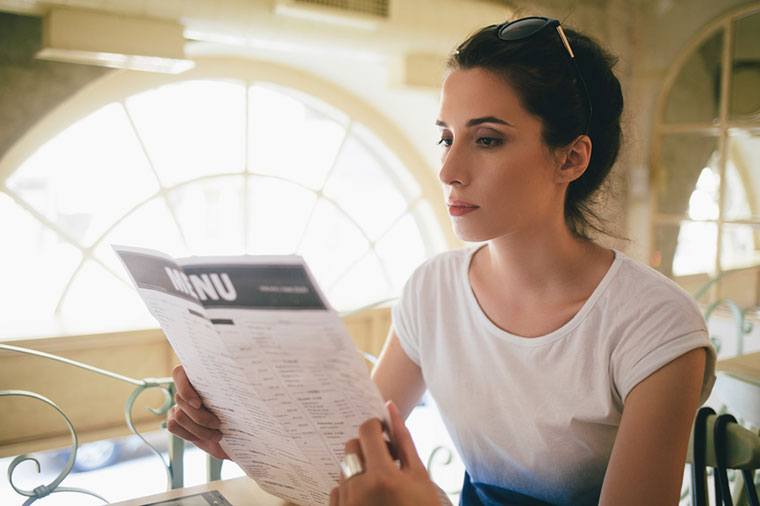woman reading menu