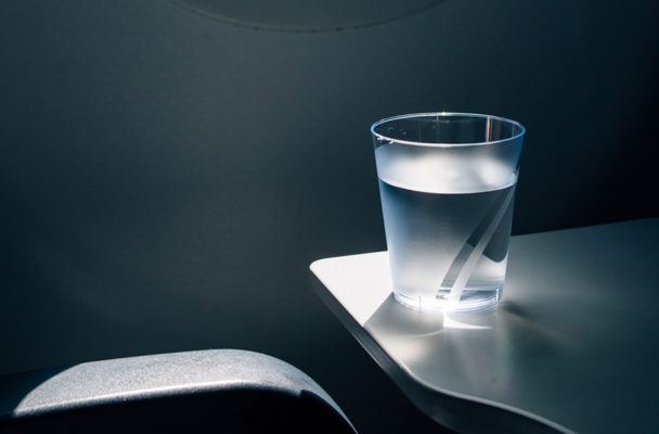 Why You Should Stock up on Water (and Ditch Caffeine and Alcohol) While Flying