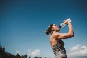 This is how much water to drink after a sweat sesh—according to doctors