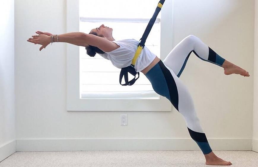 woman using TRX Home2 System
