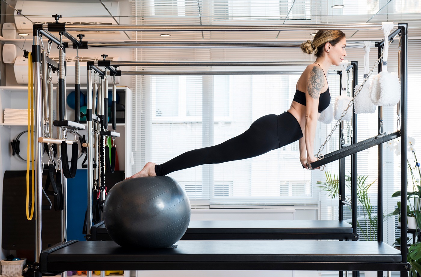 Get in an intense workout *anywhere* using this completely collapsable Pilates reformer