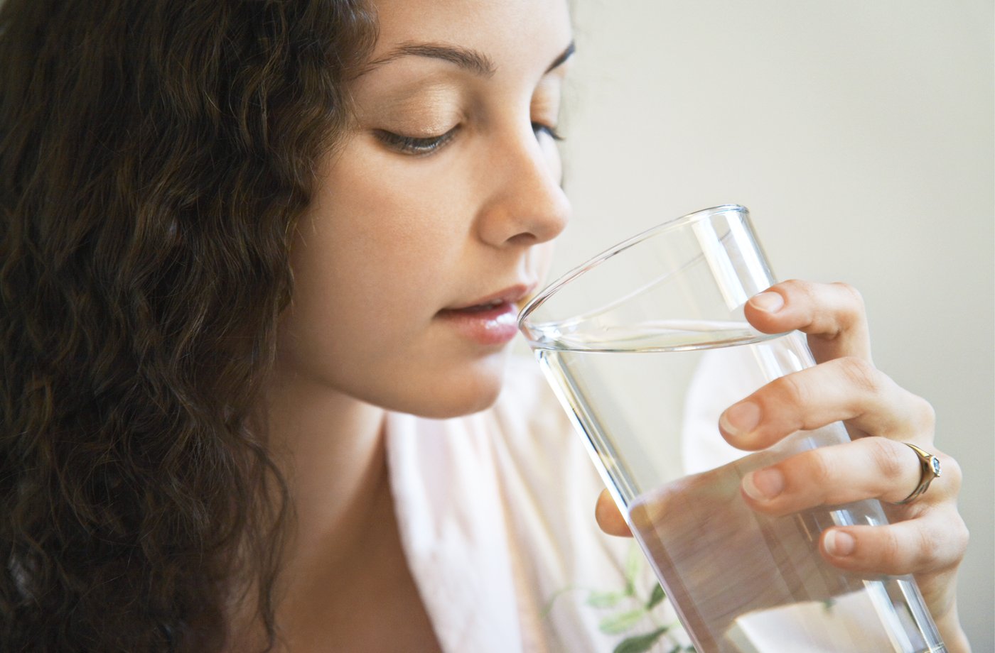 woman drinking water urinary tract infection