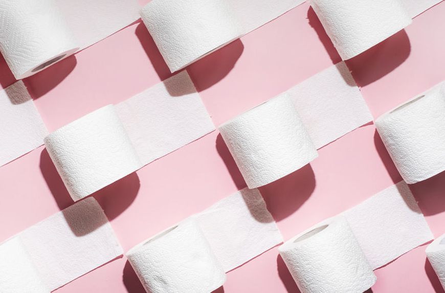 rolls of toilet paper on colored background
