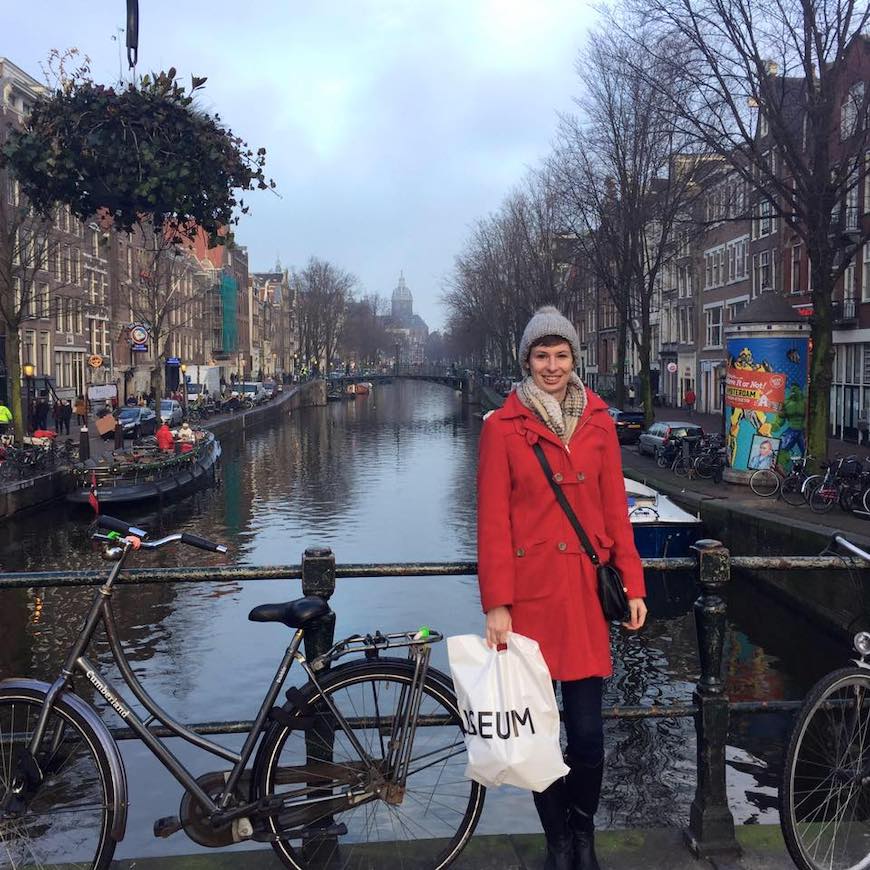 writer jessie van amburg wearing her favorite red wool coat from Land's End in Amsterdam