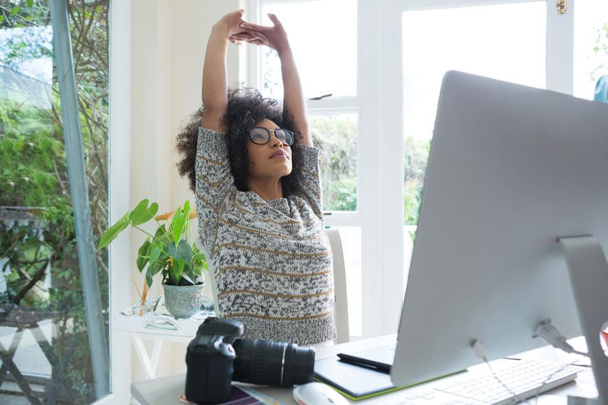 Four easy stretches you need after a long day of not leaving your desk, because #PolarVortex