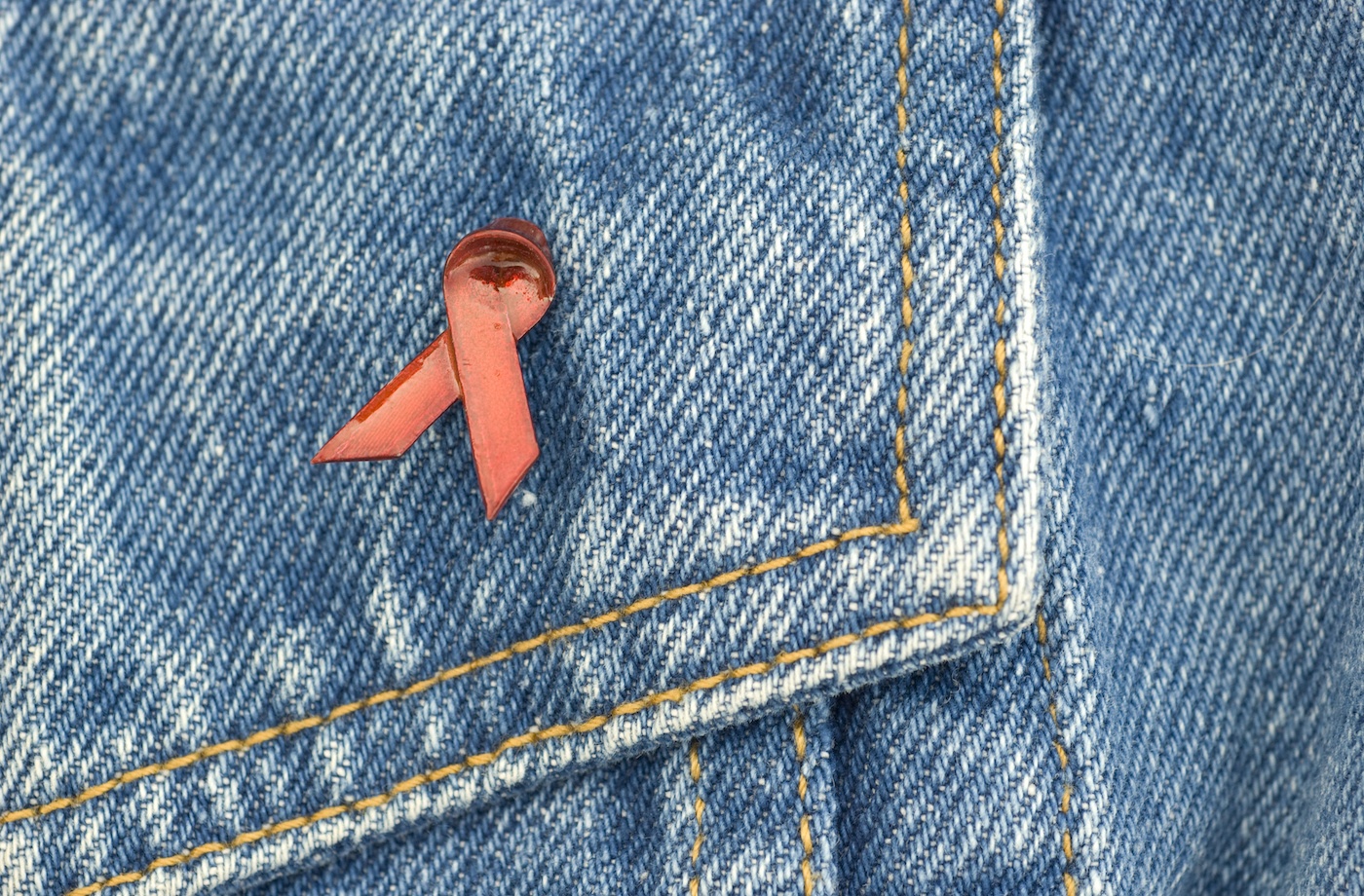hiv aids awareness pin on denim jacket