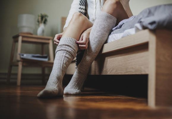 Wearing Wet Socks to Bed Probably Won't Prevent a Cold, but You Do You