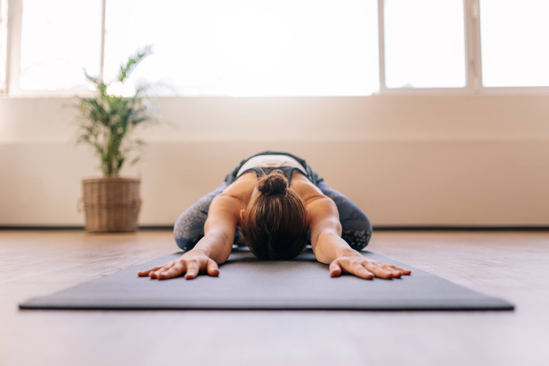How to Do Happy Baby (Ananda Balasana) in Yoga and Pilates