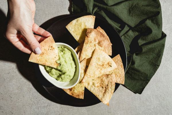Trader Joe's New Tortilla Chips Are Seasoned With Brussels Sprouts—and I Ate the Whole Bag...