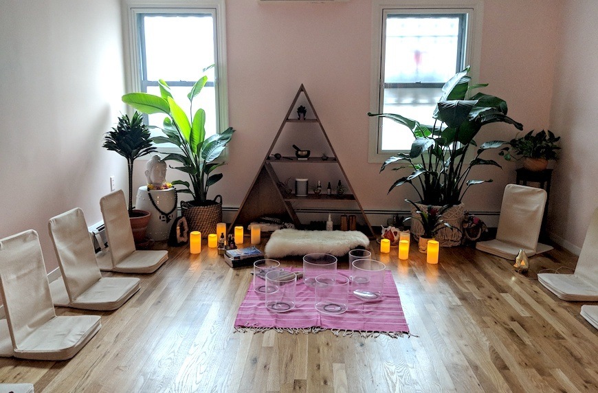 mama glow doula community center meditation room with candles and cushions