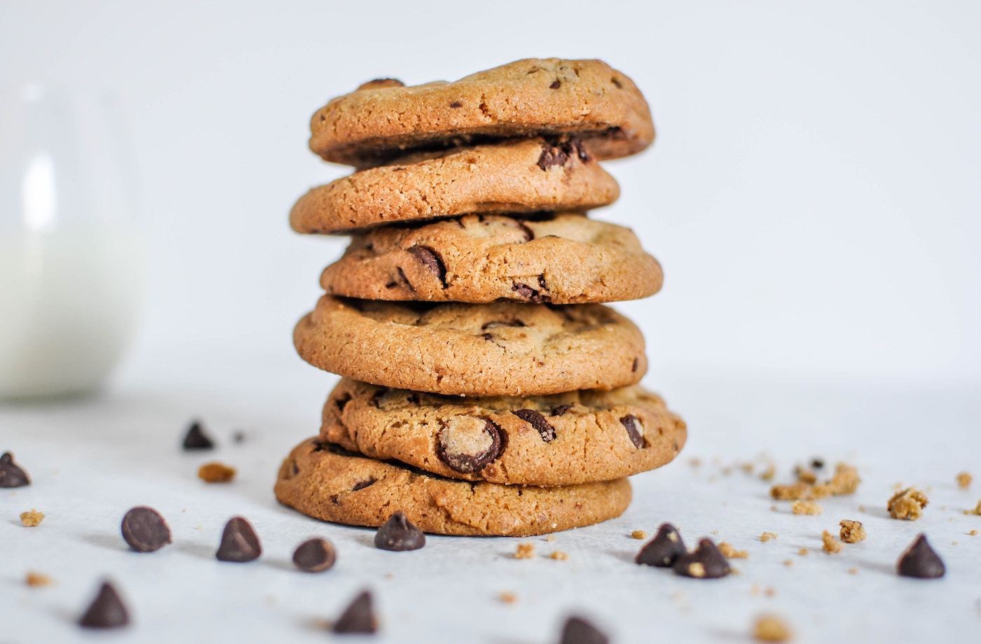 cbd edibles chocolate chip cookies stacked on white table