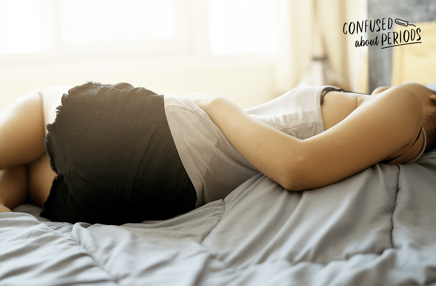 menstrual cycle woman lying on bed
