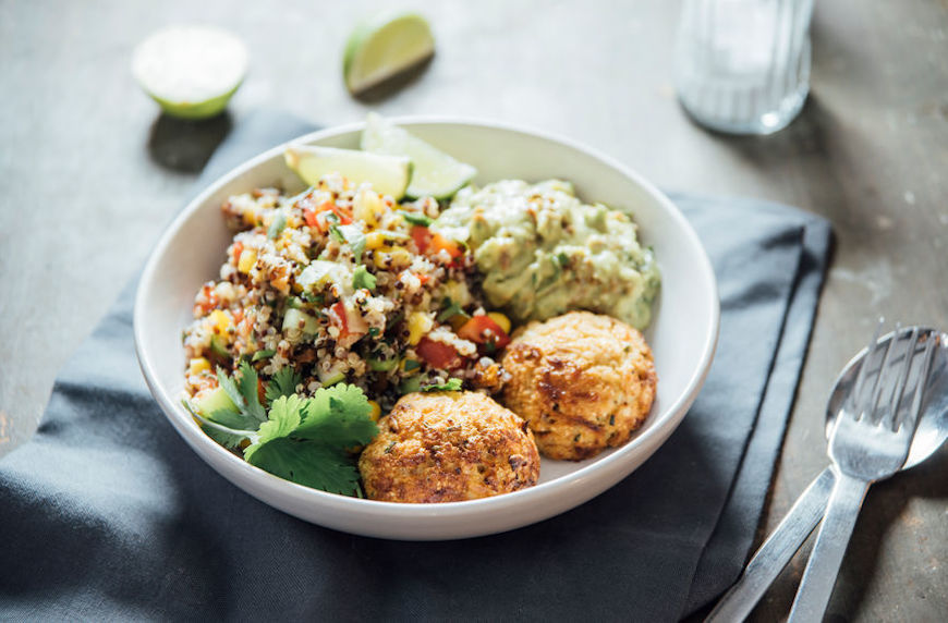 vegan mediterranean diet quinoa bowl with falafel, corn, and lime