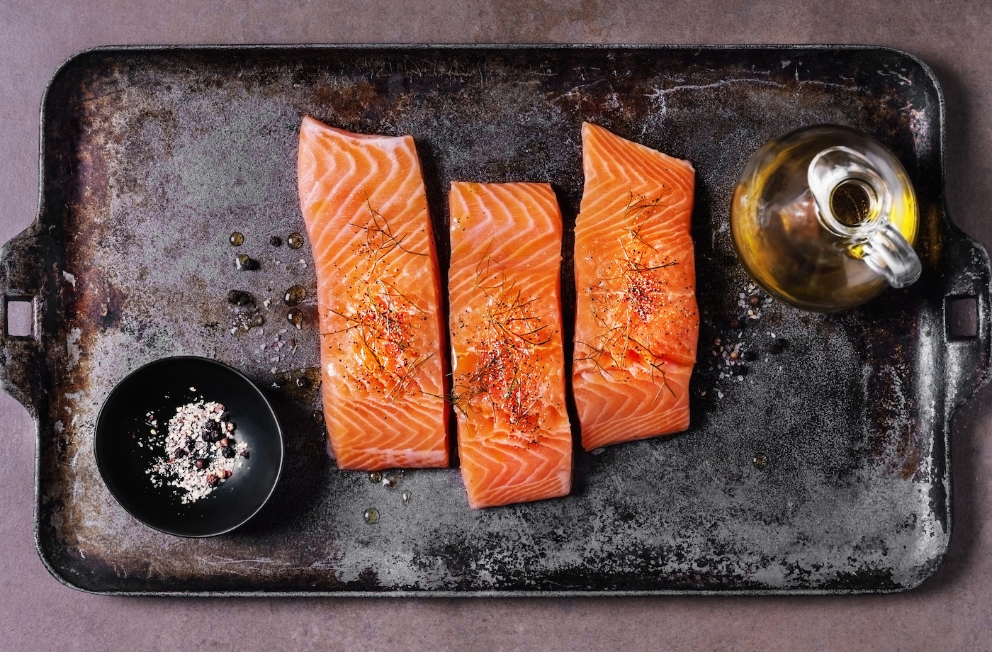 health benefits of salmon fresh salmon filets on sheet pan