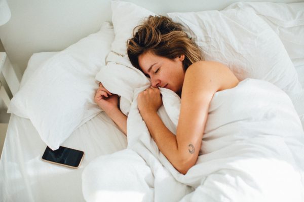 How to Decompress Your Spine While You Sleep, According to a Professional Stretcher