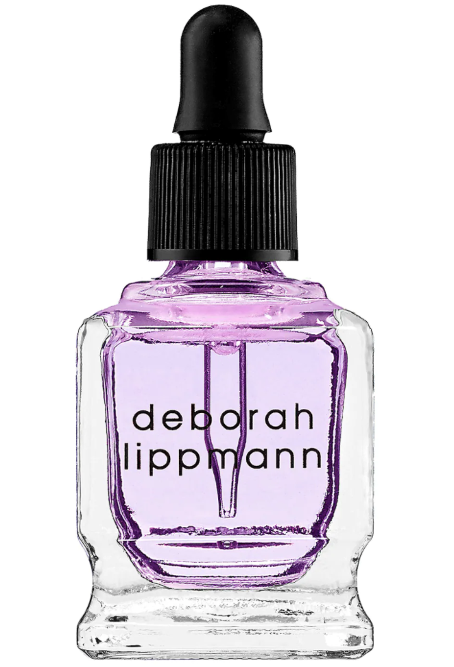 A bottle of purple Deborah Lippmann Cuticle Oil for fixing broken nails
