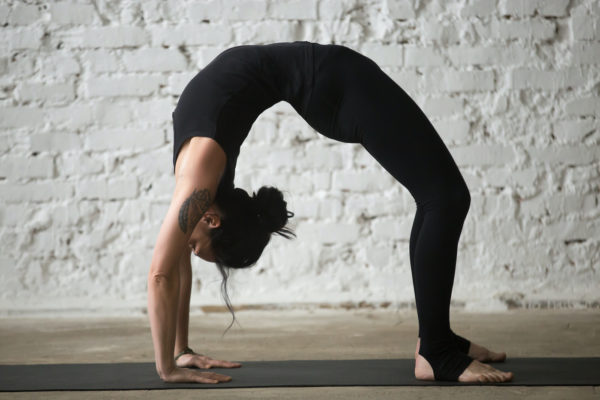 How to Do Wheel Pose the Right Way, Straight From a Yoga Pro