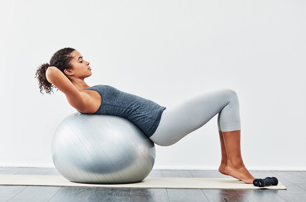 5 Moves That Prove an Exercise Ball Is the Underrated Way to Stretch Your Lower...