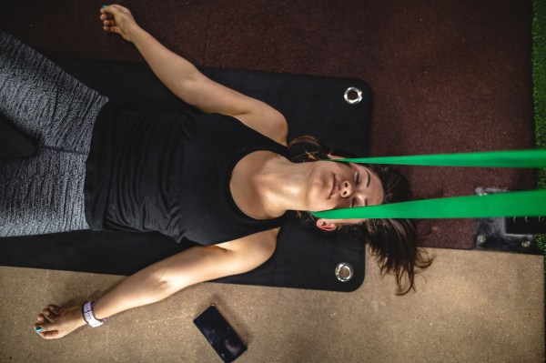 All You Need Is a Towel and a Resistance Band for This 5-Minute Neck Decompression...