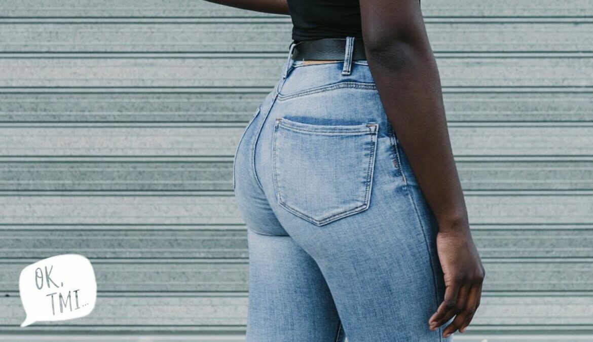 The backside of a woman wearing jeans, representing anus cramps during period