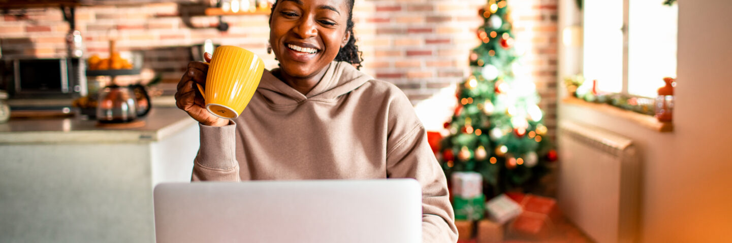 Young woman using a laptop during Christmas