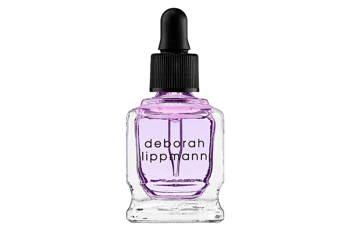 A bottle of purple deborah lipmann cuticle oil treatment