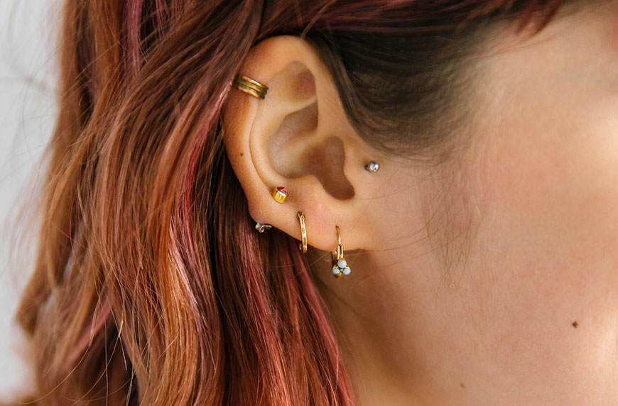 Woman wondering how often to change earrings