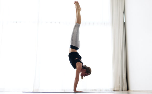 Anyone (Literally, Anyone) Can Do a Handstand Push-Up With This Strength-Building Plan