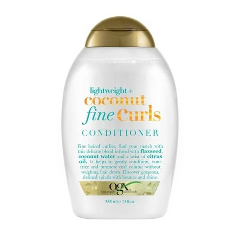 A bottle of ogx lightweight coconut fine curls conditioner for curly hair