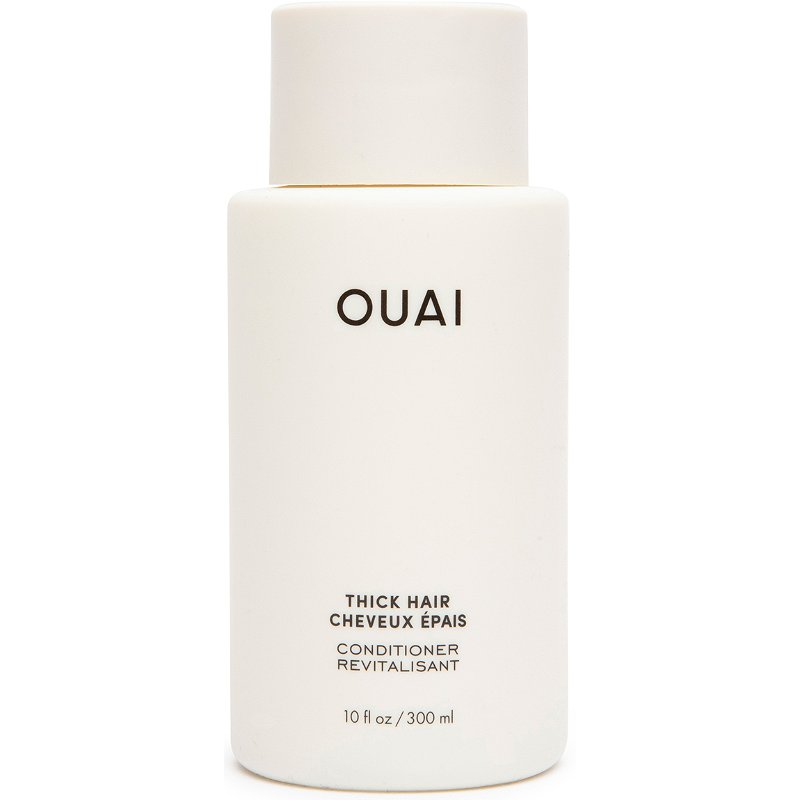 A bottle of OUAI thick hair conditioner for curly hair