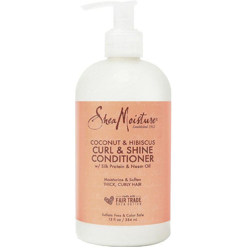 A pump bottle of shea moisture coconut and hibiscus conditioner for curly hair