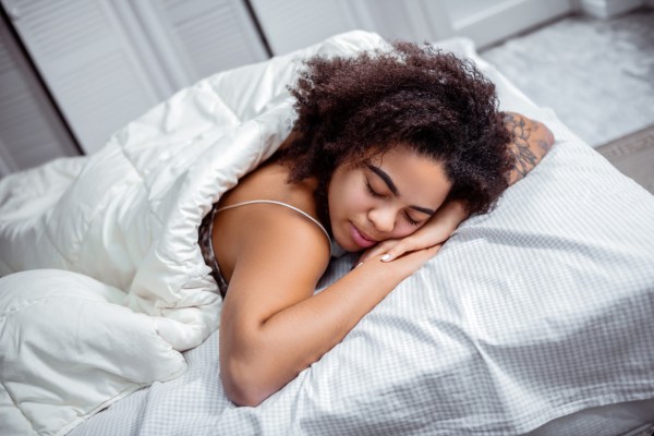 How To Train Yourself *Not* To Sleep on Your Stomach (Because Docs Advise Against It)