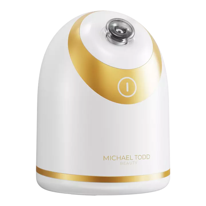 A gold and white facial steamer from michael todd beauty