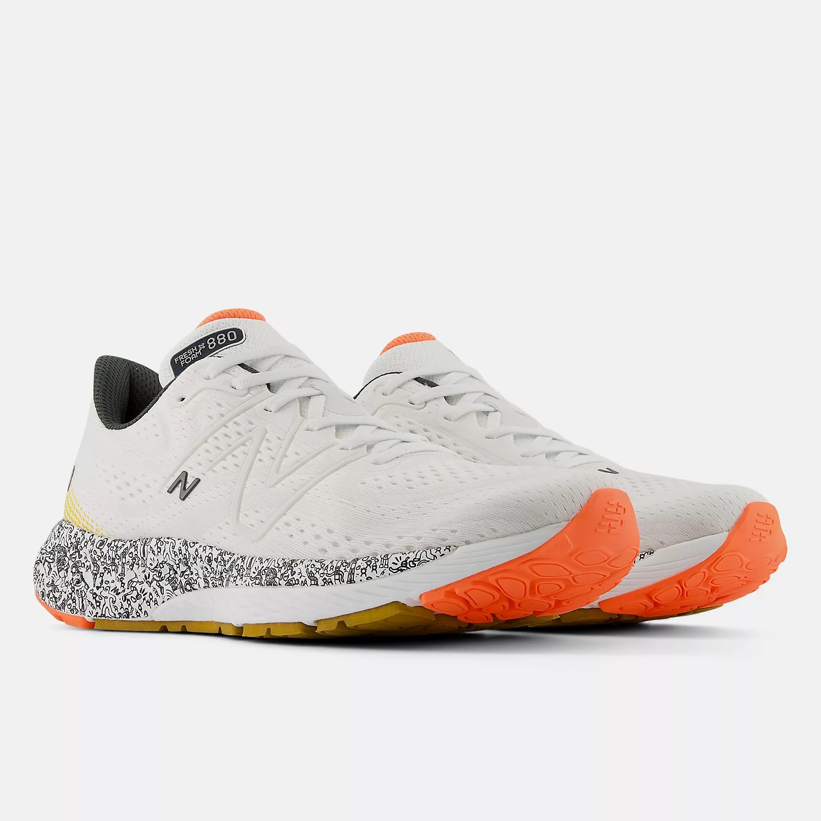 White shoes with orange sole tip