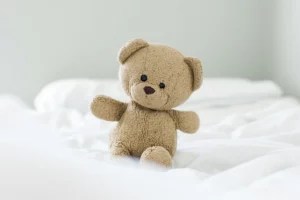 Experts Dish on Whether It’s Healthy for Your Childhood Teddy Bear To Still Be Your VIP Bedmate