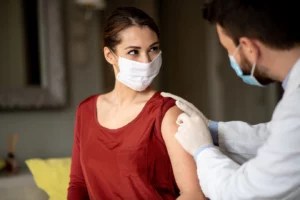 Why Immunologists Say It's a Smart Idea To Get Your Flu Shot at the Same Time as Your COVID-19 Booster (If You Qualify)