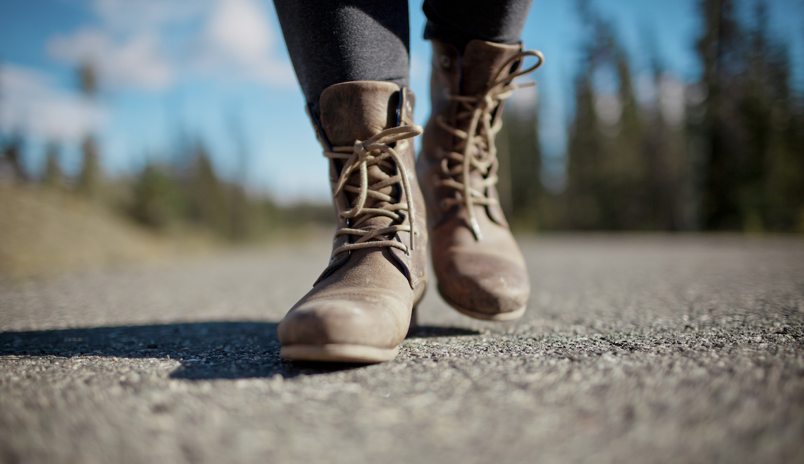 woman walking with boots for arch support