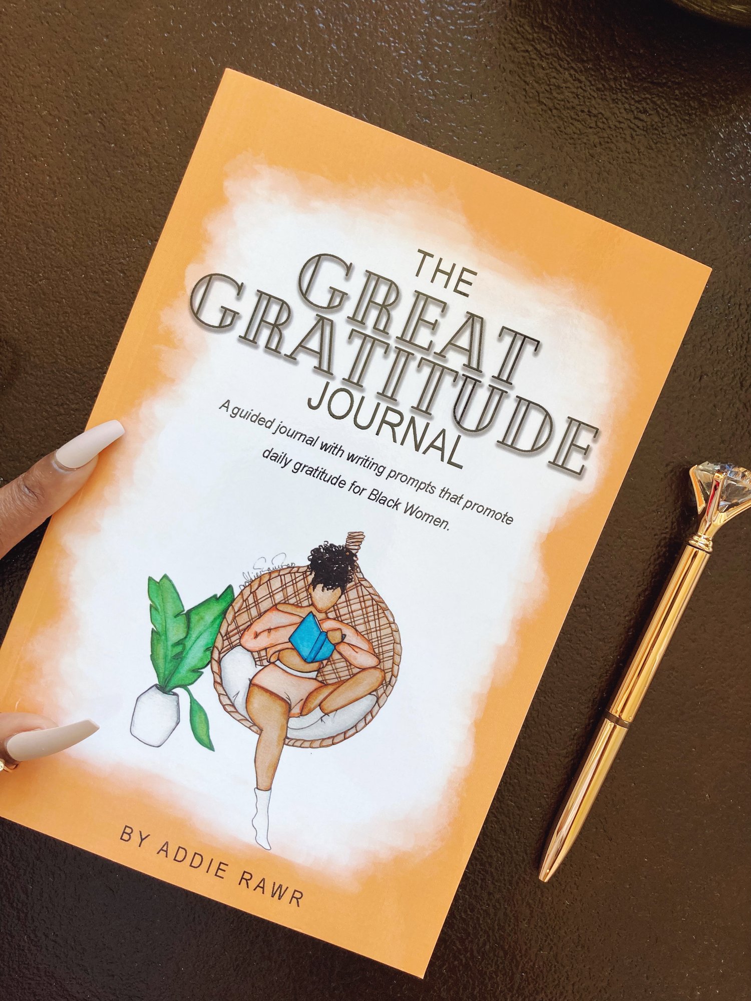 great gratitude journal with a pen next to it