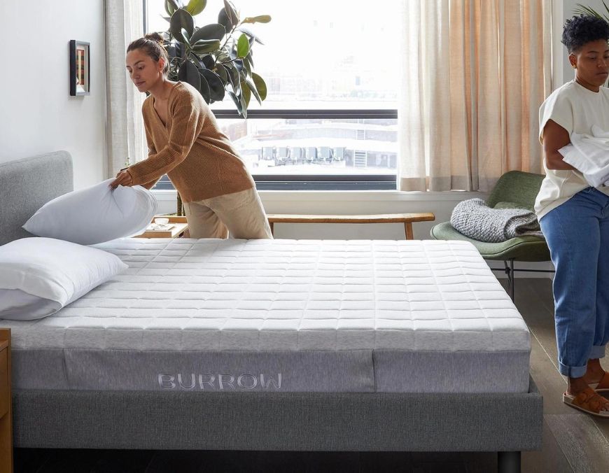 couple setting up a burrow mattress from the presidents' day sale