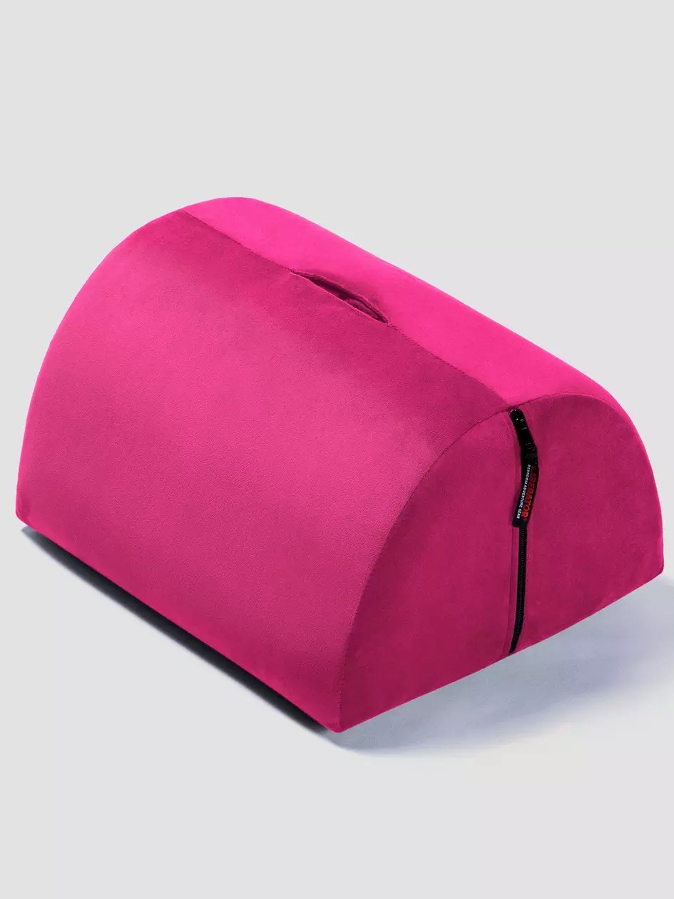 liberator bon bon pillow, one of the best sex pillows, in pink
