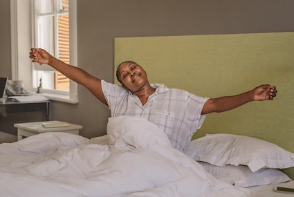 4 Mobility Moves To Do in Bed for Better Sleep, According to a Chiropractor