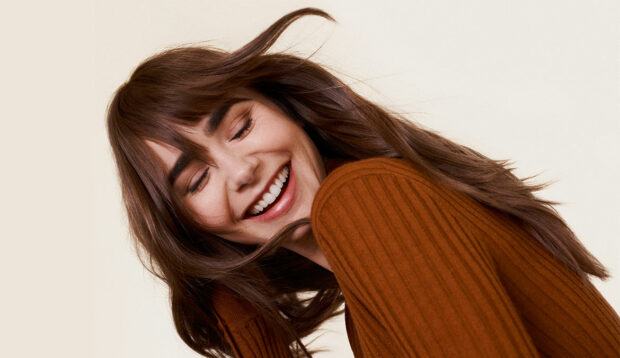 The Weightless, Frizz-Fighting Product Lily Collins Swears By To Keep Her Hair Smooth, Shiny, and...