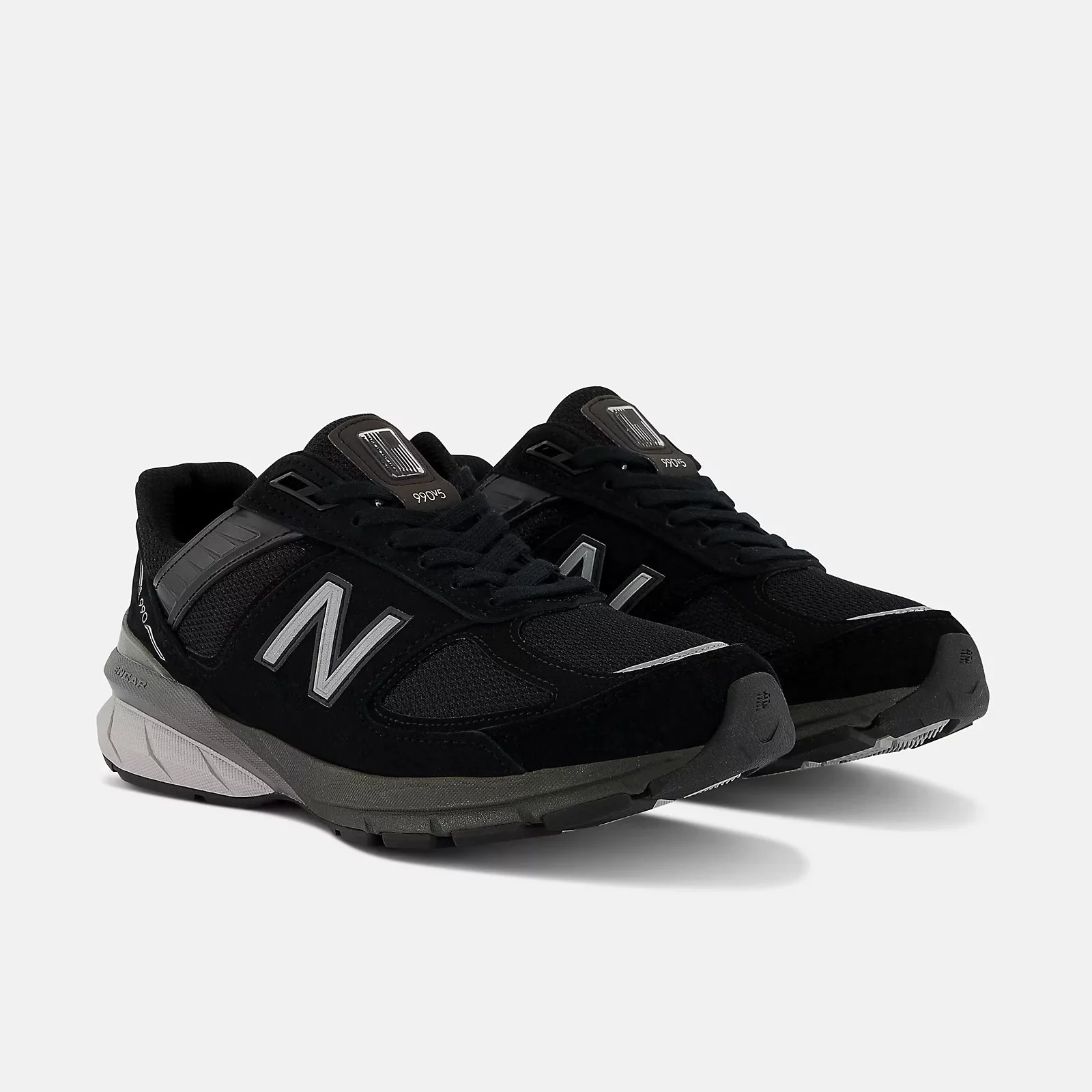 a black pair of new balance 990v5 shoes