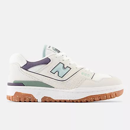 a white and blue pair of new balance 550 sneakers