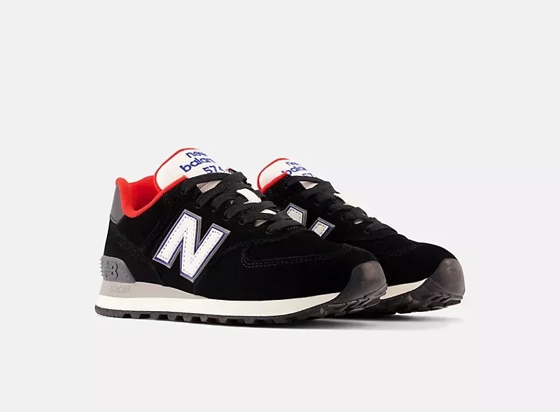 a black pair of new balance 574 shoes