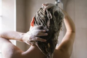 How, Exactly, Does Dandruff Shampoo Work? A Dermatologist Explains